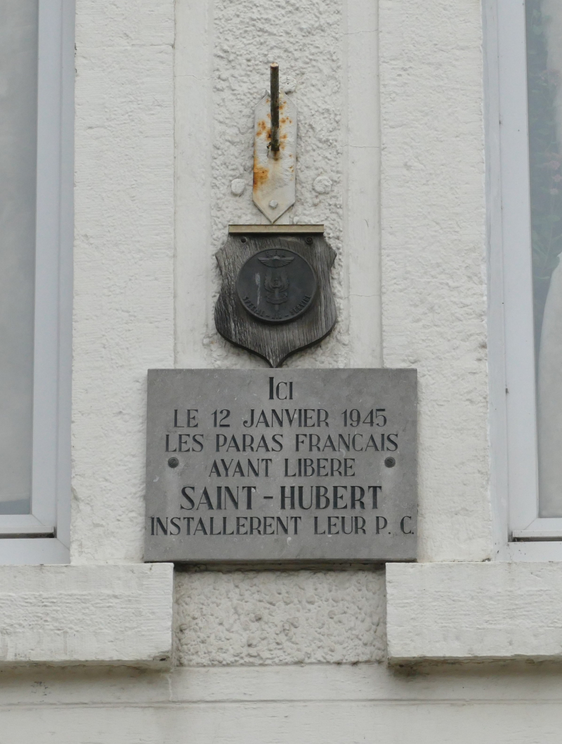 St Hubert plaque to the French paras on house near town hall